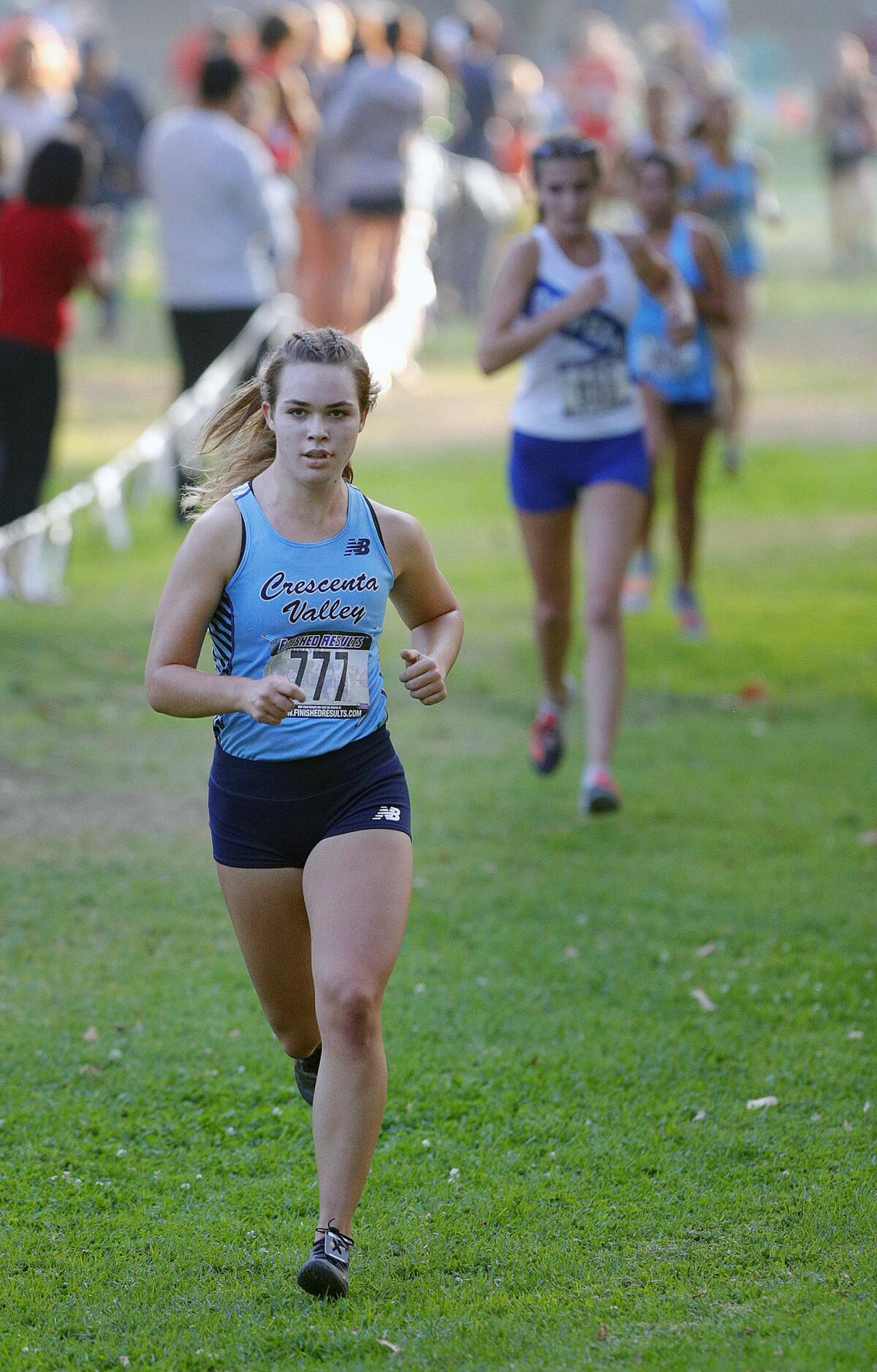 Crescenta Valley's Sophia Atin leads the race in the final mile in a Pacific League cross country meet at Arcadia Park in Arcadia on Thursday, November 7, 2019. This is the final league meet of the season.