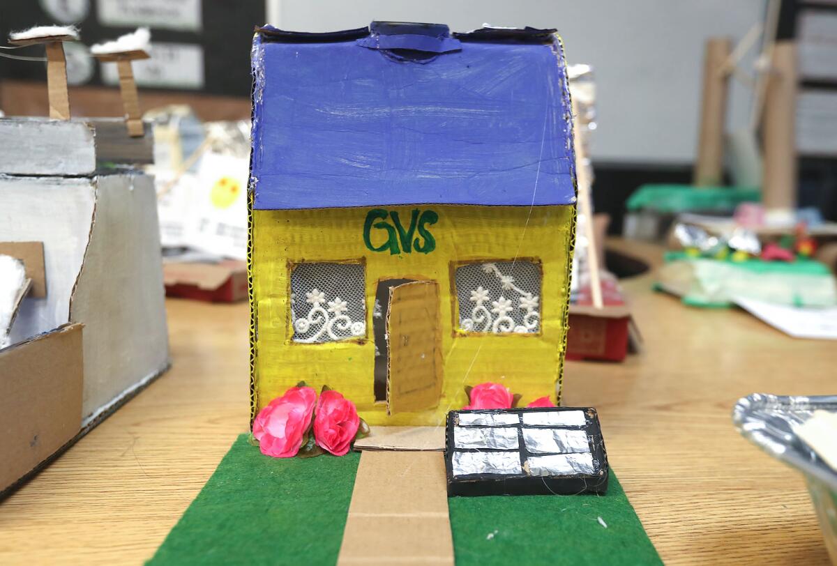 A student's solar power house is shown during the Environmental Science Civic Engagement Showcase at Golden View Elementary.