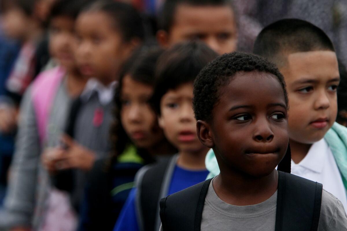 Dillen Gilmore, 6, is first in line in his first grade class, on the first day of school at Fair Elementary School, in North Hollywood, CA August 13, 2013.
