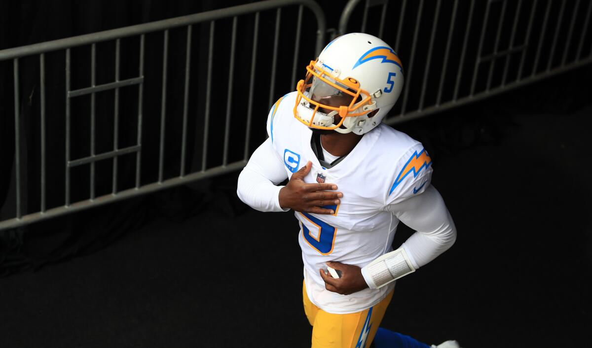 Chargers quarterback Tyrod Taylor runs onto the field before a game against the Cincinnati Bengals on Sept. 13.