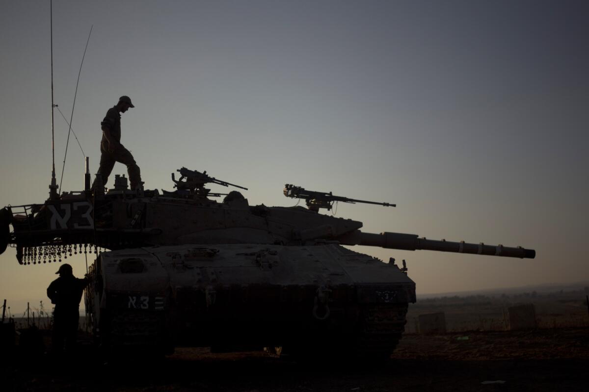 An Israeli tank near the border with Syria earlier this month. As part of the budget passed Tuesday, the Israeli army is selling some equipment, including tanks, to raise revenue.