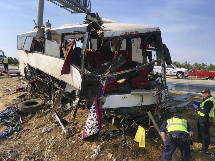 Authorities investigate the scene of a charter bus crash on northbound Highway 99 between Atwater and Livingston on Tuesday.