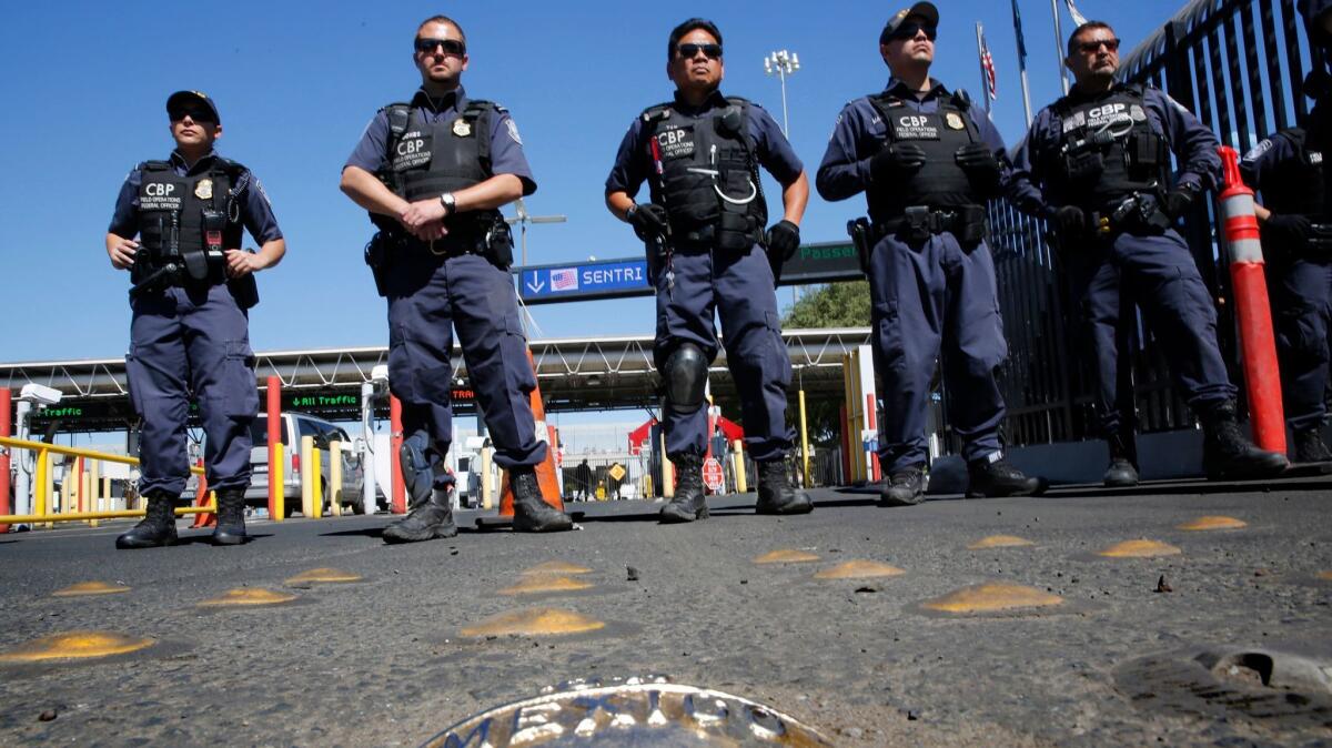 U.S. Customs and Border Protection officers span the northbound approach to the Otay Mesa Port of Entry from Tijuana. Daniel Gomez, a U.S. citizen who plays with the Club Tijuana Xoloitzcuintles de Caliente’s reserve team, was arrested April 5 at the crossing.