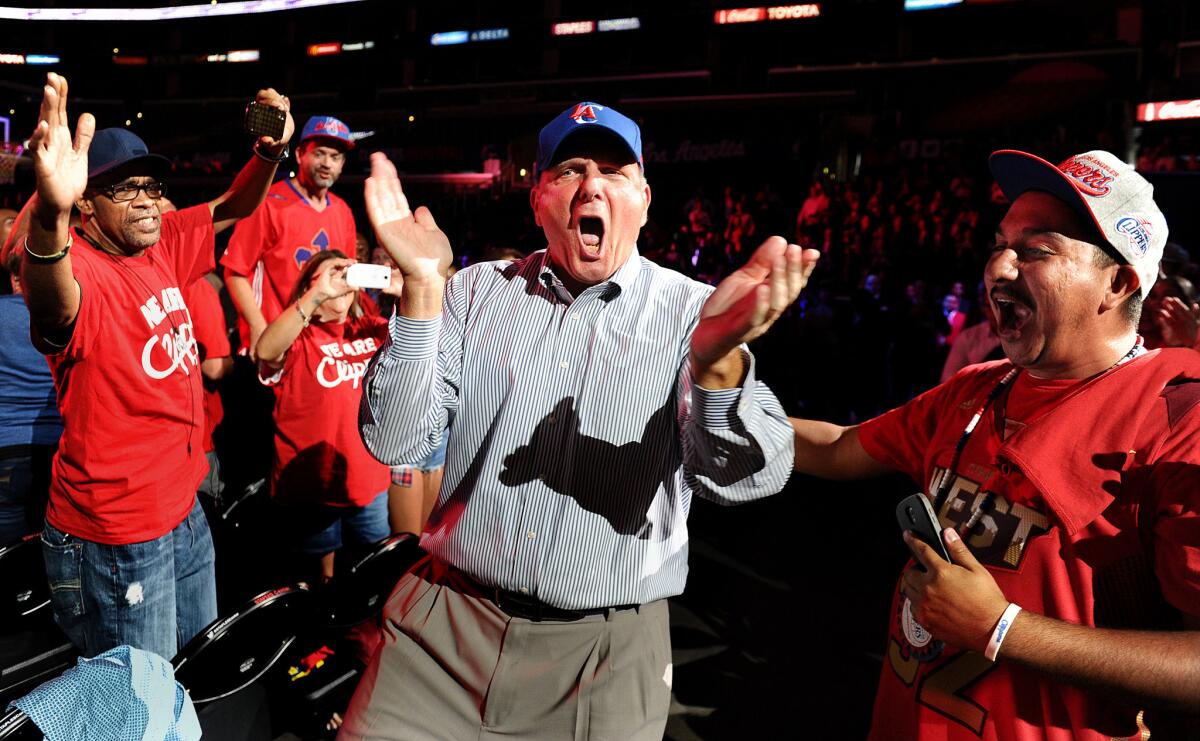 New Clippers owner Steve Ballmer greets fans during a rally at Staples Center on Monday.
