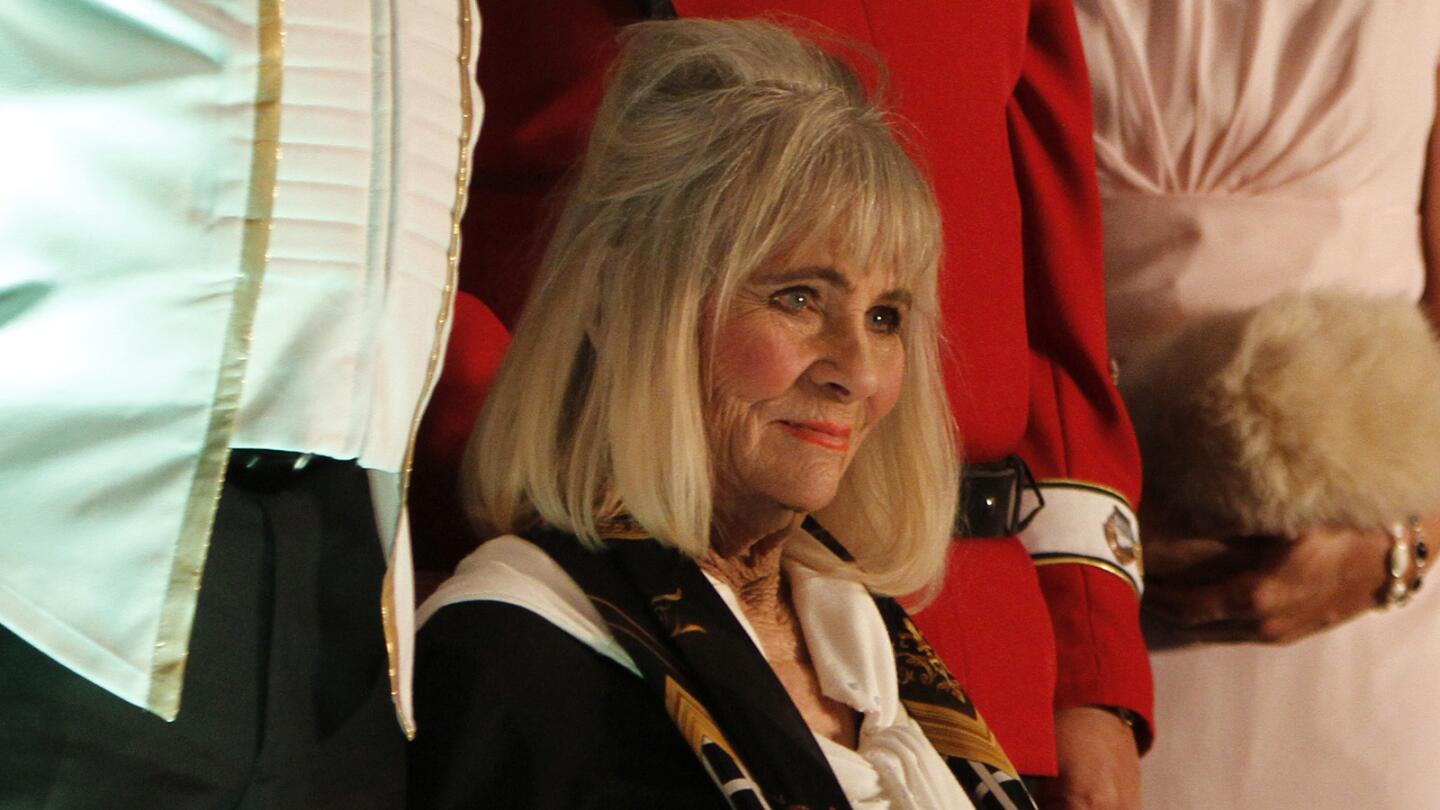 Grace Lee Whitney, seated, who played Yeoman Rand in the original "Star Trek" series, stood in for the mother of the bride during Mark Restucci and Amy Campbell's wedding at the annual "Star Trek" convention at the Rio hotel and casino in Las Vegas in 2014.