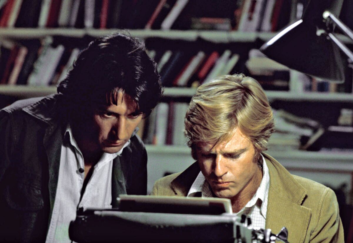 Dustin Hoffman, left, and Robert Redford at a typewriter in the 1976 film "All the President's Men." 