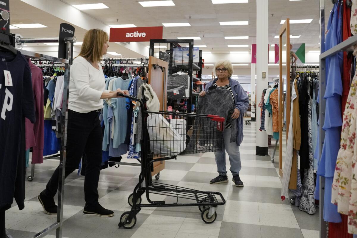 Customers shop at a retail store in Vernon Hills, Ill., 