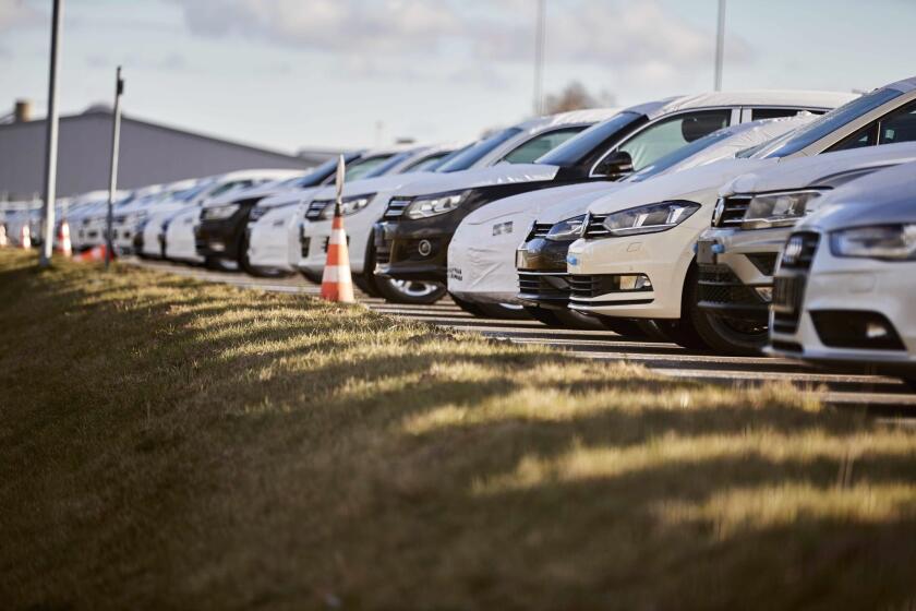 Volkswagen cars parked in Wolfsburg, Germany, headquarters of the carmaker. The U.S. Environmental Protection Agency and the California Air Resources Board said Friday they have approved a fix for about 67,000 Volkswagens and Audis programmed to cheat on U.S. emissions tests.