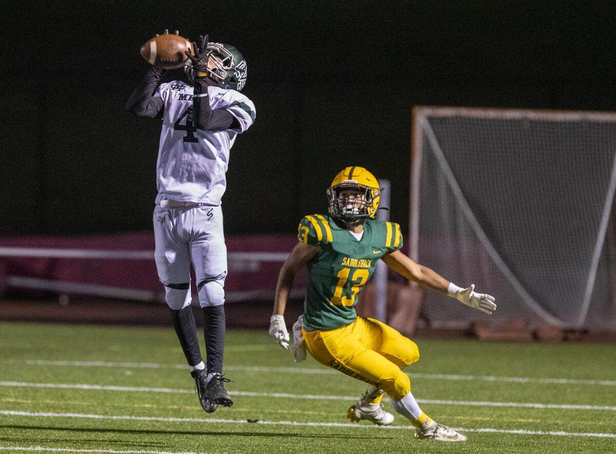 Costa Mesa's Christian Beatty intercepts a pass intended for Saddleback's Isaias Ramirez on Thursday.