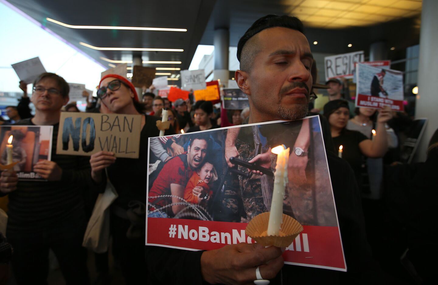 Protesters gather at Tom Bradley International Terminal at LAX to oppose President Trump's refugee ban.