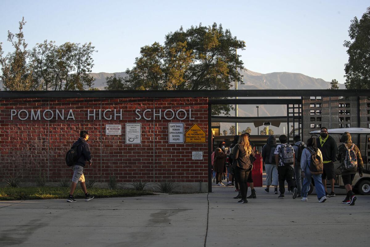 Students walk into Pomona High School.