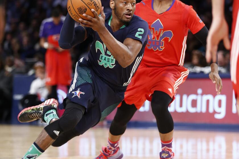 John Wall, left, driving past Chris Paul in the NBA All-Star game, is averaging 19.8 points and 8.8 assists for the Washington Wizards.