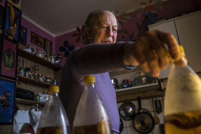 Boris Korkin, an artist, who's been making combucha for himself and his friends for about 20 years is posing for a portrait in his apartment in Moscow. February 8th, 2018.