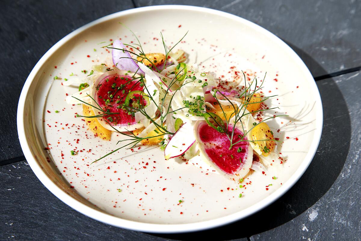 From the "Raw" menu: Hamachi with shaved fennel, white soy, wasabi and market citrus served at Paley.
