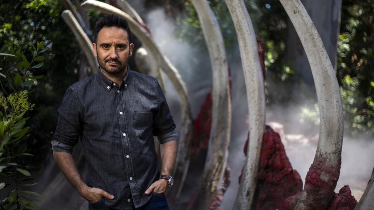 J.A. Bayona, director of "Jurassic World: Fallen Kingdom," poses for a portrait on the Universal Studios back lot.