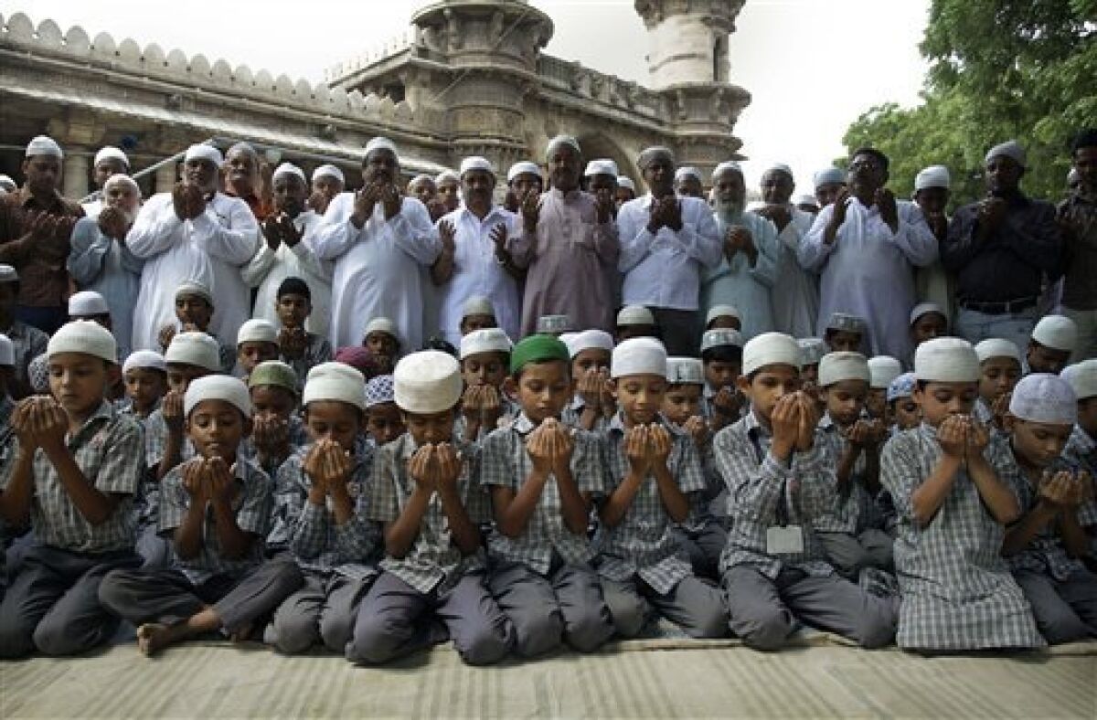 Muslims prays for peace and communal harmony before the Ayodhya verdict, at a mosque in Ahmadabad, India, Thursday,Sept. 30, 2010. An Indian court ruled Thursday that a disputed holy site that has sparked bloody communal riots across the country in the past should be divided between the Hindu and Muslim communities.However, the court gave the Hindu community control over the section where the now demolished Babri Mosque stood and where a small makeshift tent-shrine to the Hindu god Rama rests. While both Muslim and Hindu lawyers vowed to appeal to the Supreme Court, the compromise ruling seemed unlikely to set off a new round of violence, as the government had feared. (AP Photo/Ajit Solanki)