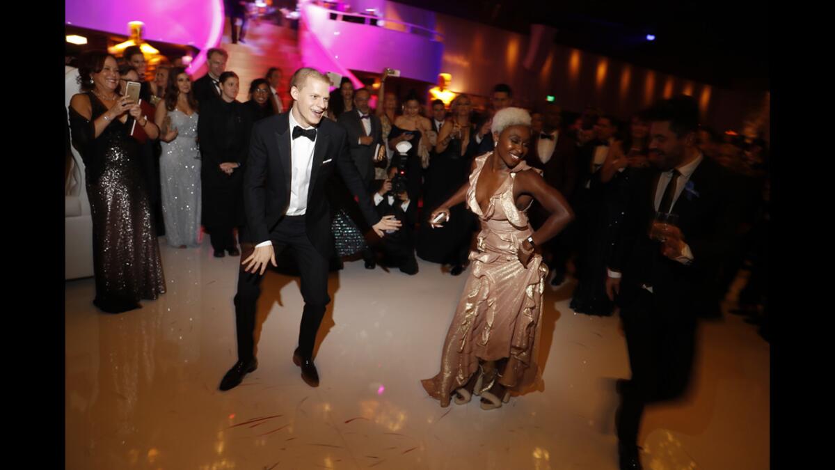 Lucas Hedges and Cynthia Erivo get down at the 89th Academy Awards Governors Ball. (Jay L. Clendenin / Los Angeles Times)