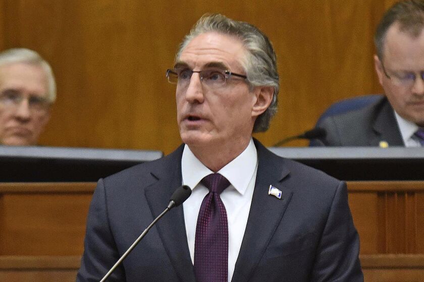 FILE - North Dakota Gov. Doug Burgum delivers his budget address before a joint session of the North Dakota Legislature in Bismarck, N.D., Dec. 5, 2018. Burgum is set to announce his candidacy for the 2024 Republican presidential nomination on Wednesday, June 7, 2023, adding his name to the long list of contenders hoping to dent former President Donald Trump’s early lead in the race. (Tom Stromme/The Bismarck Tribune via AP, File)