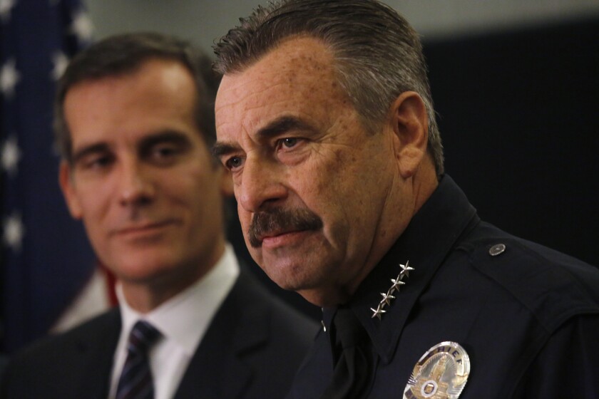 Los Angeles Mayor Eric Garcetti, left, and Los Angeles Police Chief Charlie Beck discuss 2015 crime statistics at a recent news conference.