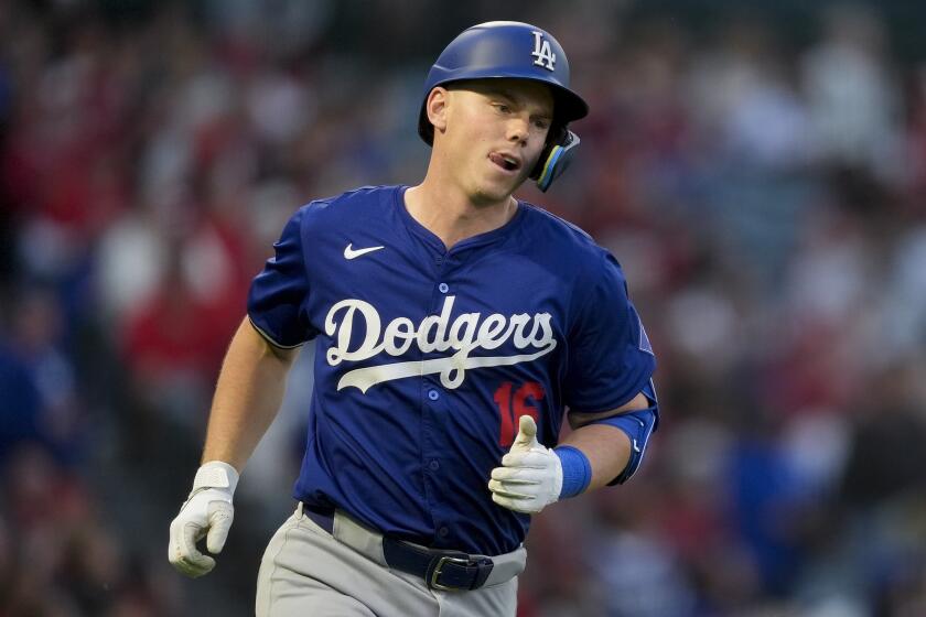 Los Angeles Dodgers' Will Smith runs hitting a home run during the fourth inning of the team's exhibition baseball game against the Los Angeles Angels, Tuesday, March 26, 2024, in Anaheim, Calif. (AP Photo/Ryan Sun)