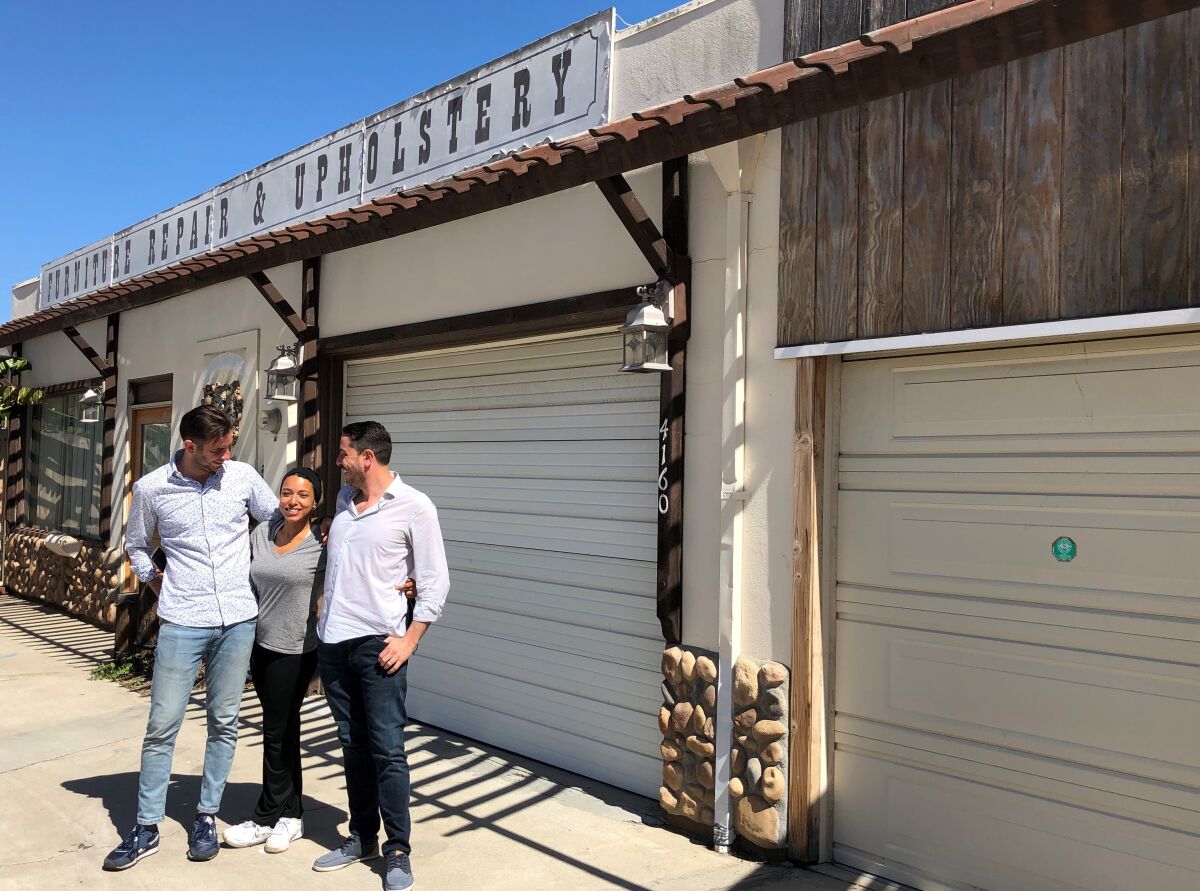 Niccolò Angius (left), Cesarina Mezzoni and Giuseppe Capasso outside their Angelo building in Point Loma.