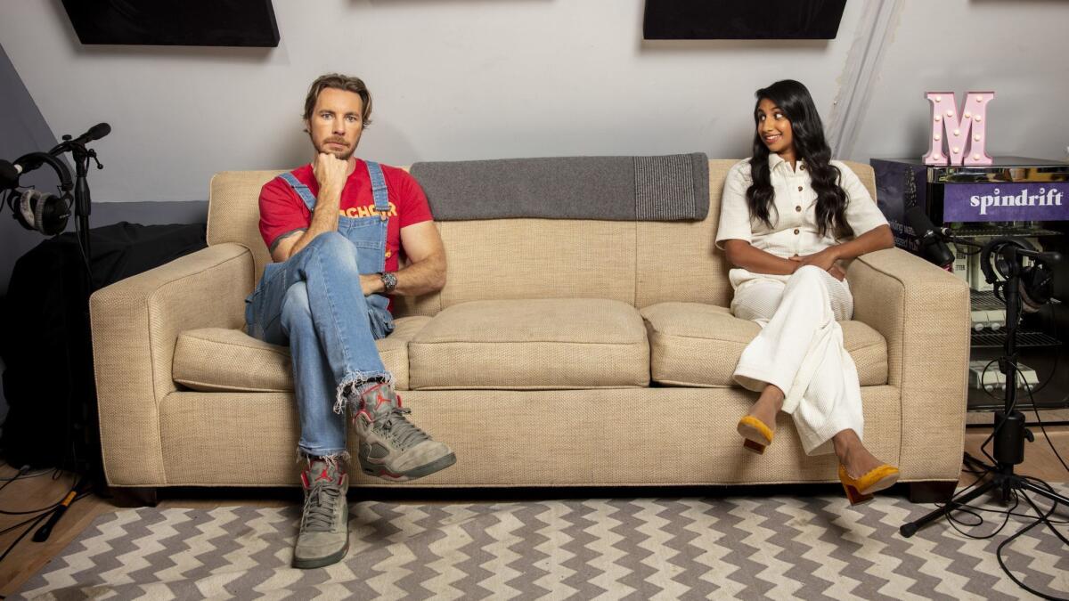 Dax Shepard and his-cohost, Monica Padman, in the improvised studio where they record their hit podcast, "Armchair Expert."