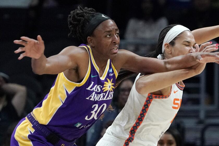 Los Angeles Sparks forward Nneka Ogwumike, left, and Connecticut Sun center Brionna Jones.