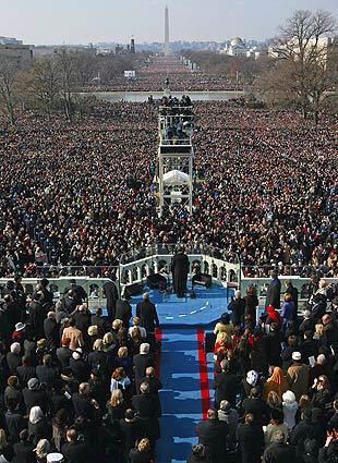 President Obama delivers his inauguration speech to an audience that extends to the Lincoln Memorial, two miles in the distance, and to clusters around the capital.
