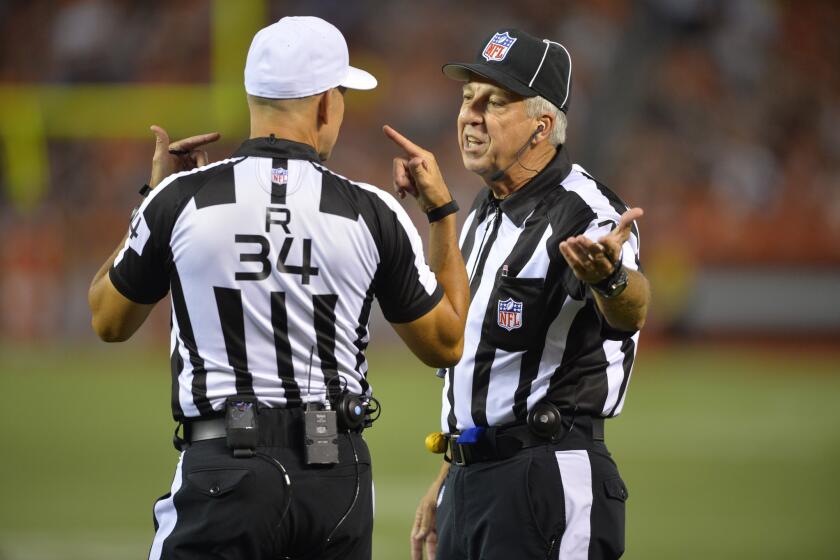 Referee Clete Blakeman (34) talks to side judge Joe Larrew during a preseason game between the Cleveland Browns and the Buffalo Bills on Aug. 20.