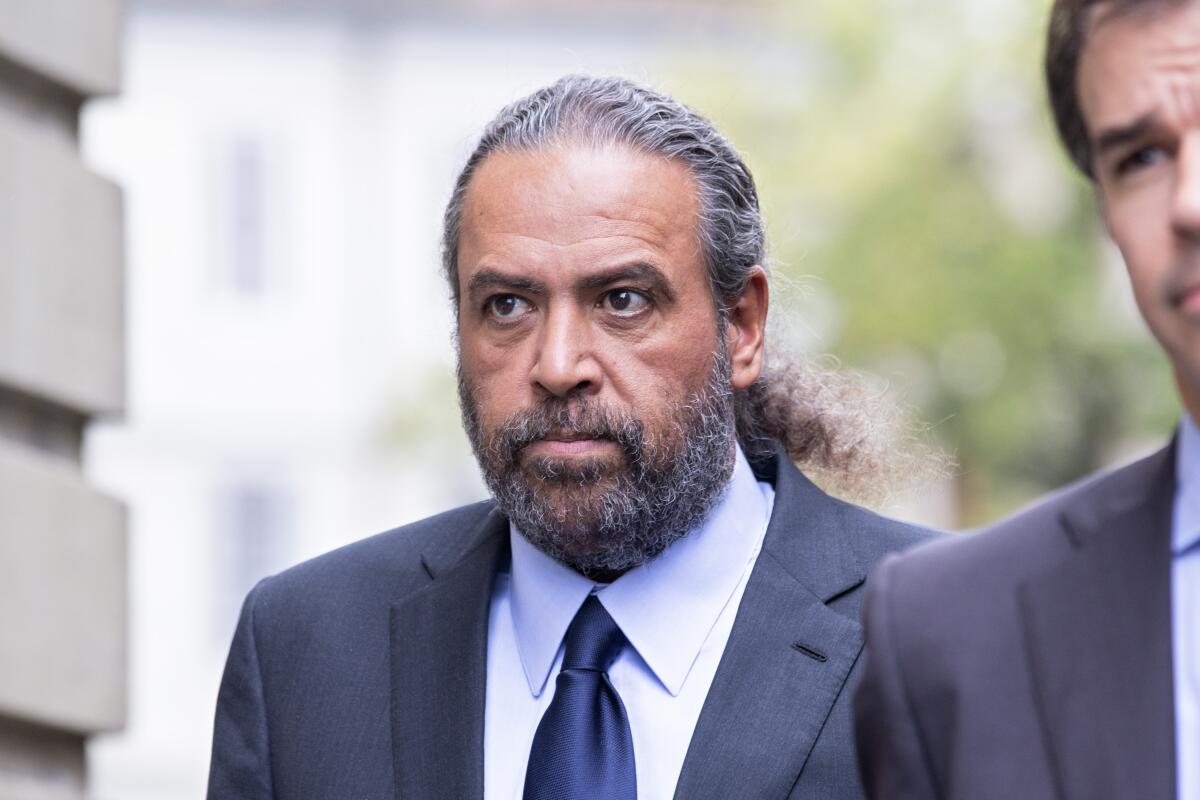 Sheikh Ahmad al-Fahad al-Sabah arrives at a Geneva's courthouse ahead of the verdict for a trial for forgery in connection with arbitration, in Geneva, Switzerland, Friday, Sept. 10, 2021. (Salvatore Di Nolfi/Keystone via AP)