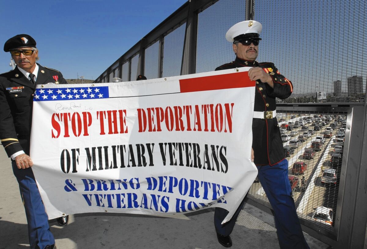 Former Army Sgt. Valente Valenzuela, left, and former Marine Lance Cpl. Manuel Valenzuela protest in San Ysidro in 2012. Each served three years in the U.S. military before they were ordered deported.