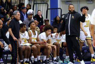 King/Drew basketball coach Lloyd Webster (right) has his team playing for a City Section Open Division title.