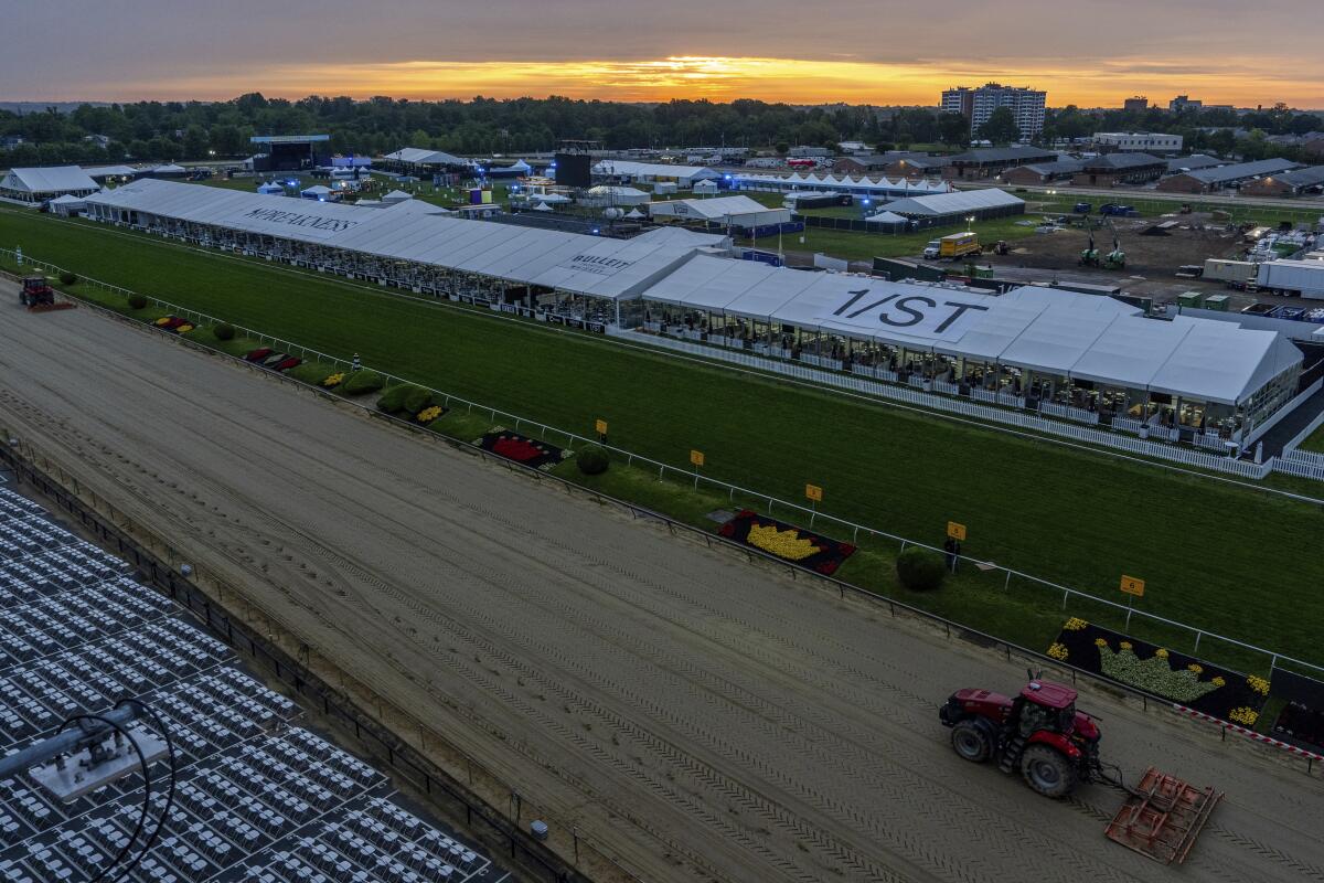 Harrows work on the track ahead of the 149th running of the Preakness Stakes horse race at Pimlico Race Course Saturday.