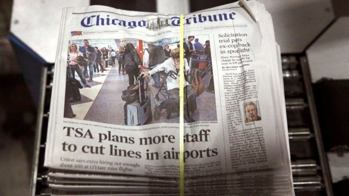 A bundle of Chicago Tribune newspapers comes off the press in 2016.