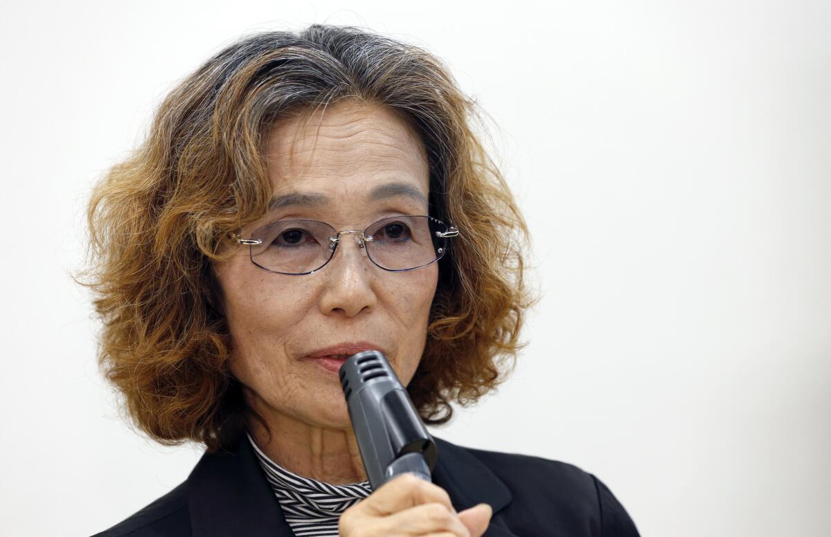 Junko Ishido, mother of Kenji Goto, a Japanese hostage held by Islamic State militants, appears at a Tokyo news conference to appeal to Japan's prime minister to intervene on her son's behalf.