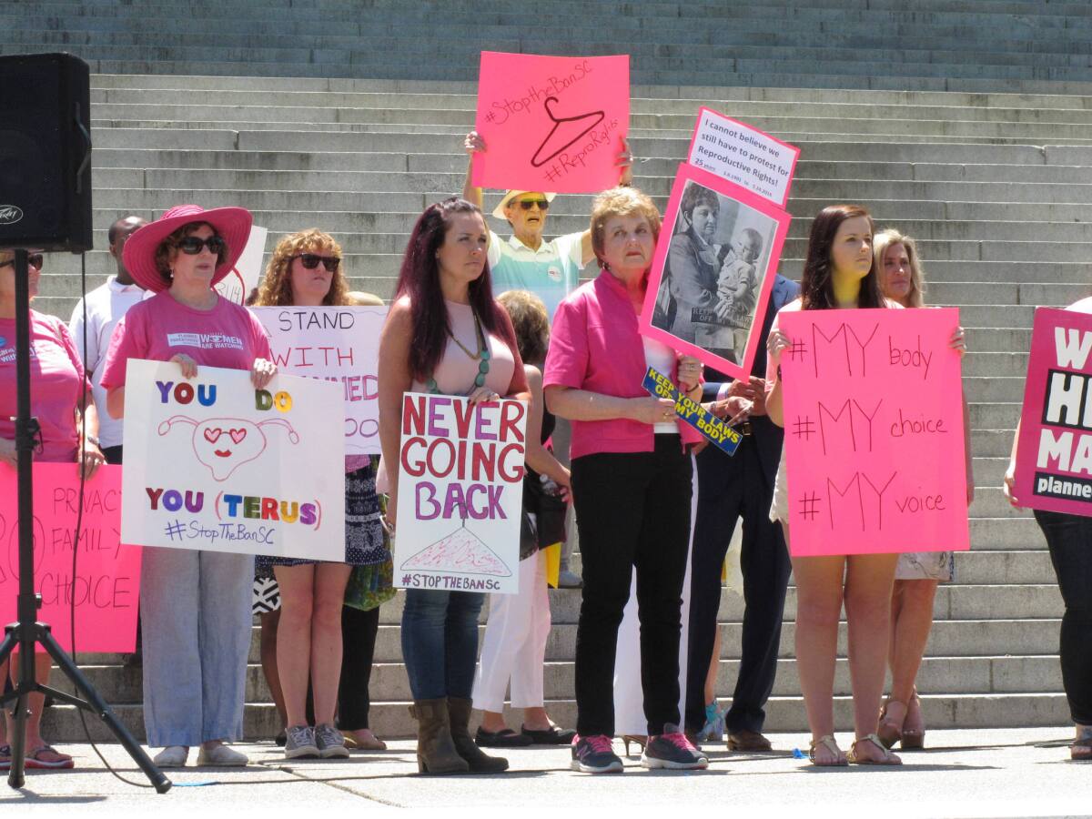 Protesters call for South Carolina Gov. Nikki Haley to veto a bill that would outlaw most abortions in the state past 20 weeks on Tuesday.