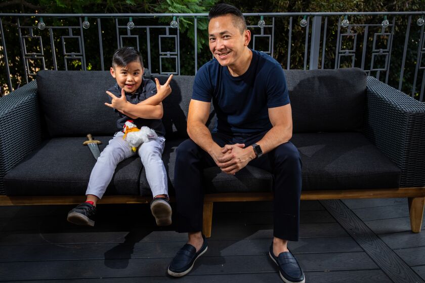 Viet Thanh Nguyen with his son Ellison in the backyard, of their Pasadena, CA, home.