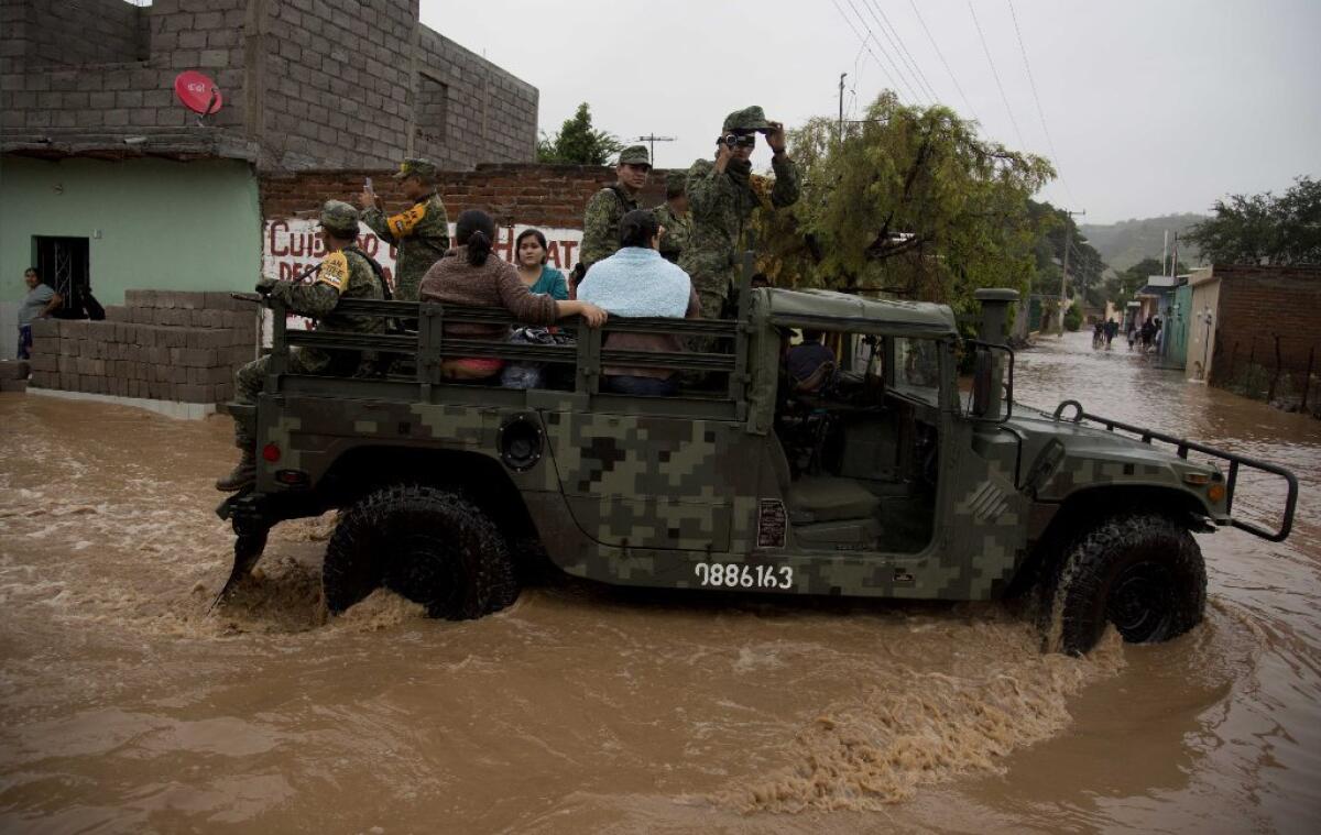 Soldiers evacuate residents to a shelter in Zoatlan, Nayarit state, some 150 km northwest of Guadalajara, Mexico.
