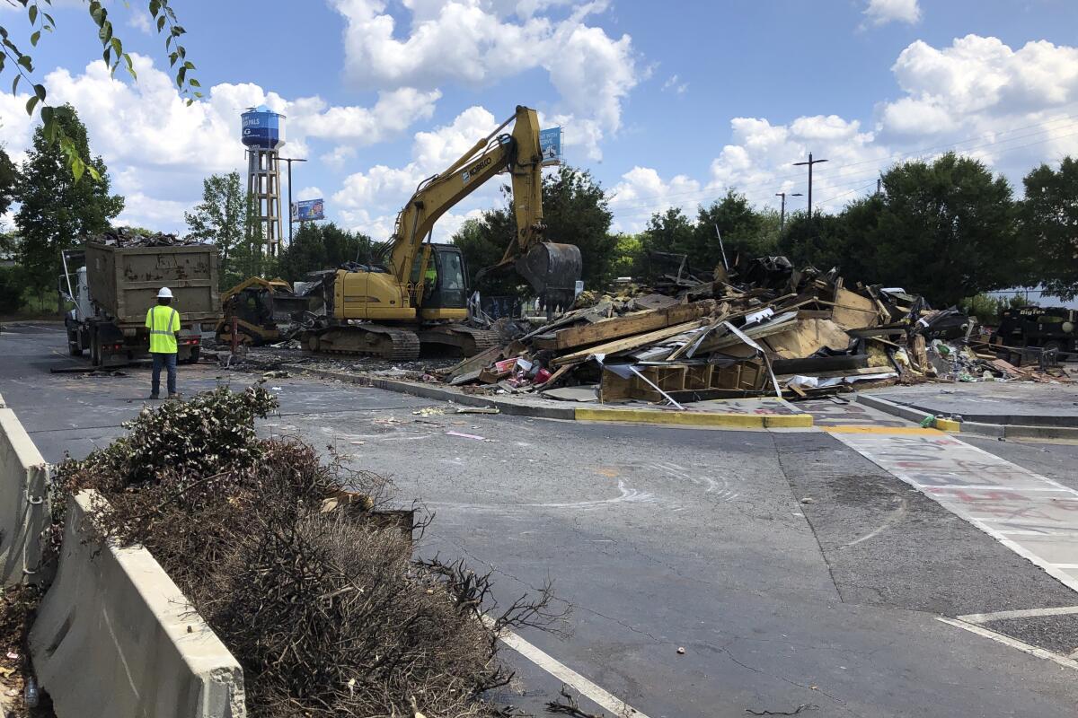 A Wendy's restaurant is demolished Tuesday in Atlanta. 