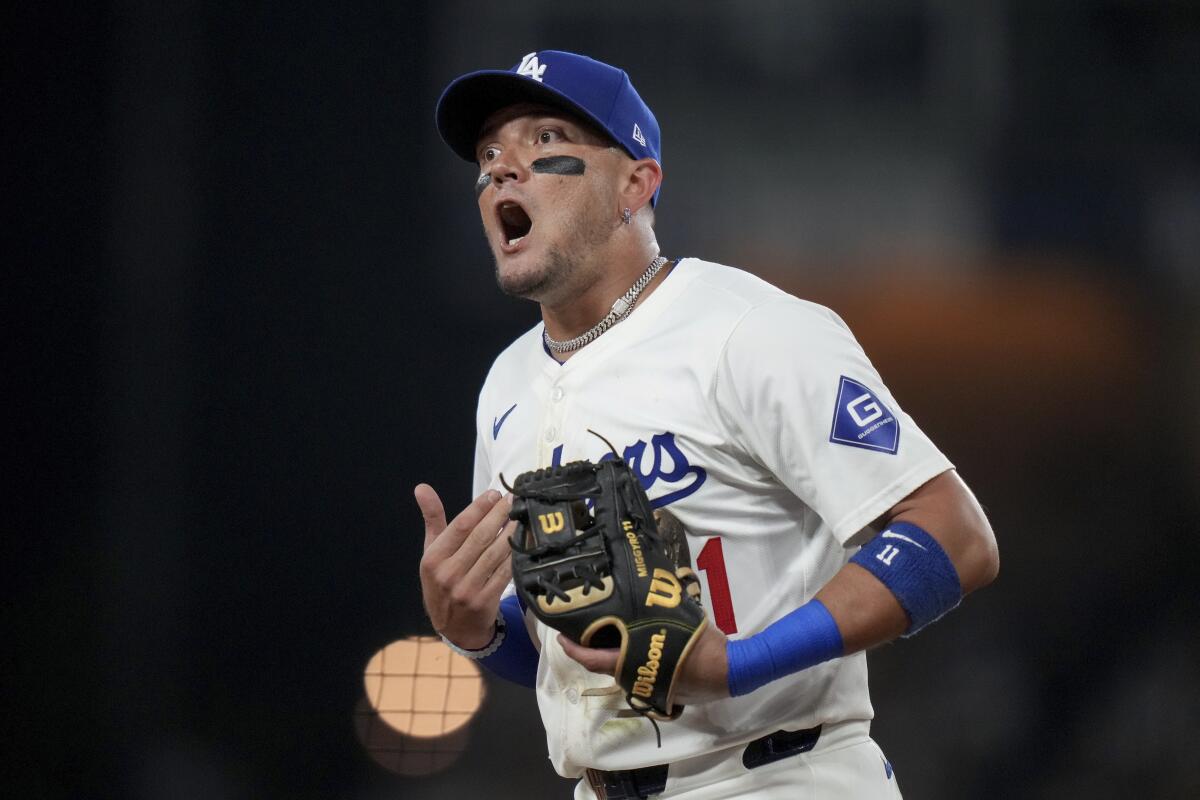 Miguel Rojas argues a call during the sixth inning.