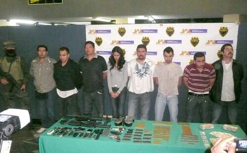 From the Associated Press A reigning Mexican beauty queen from the drug-plagued state of Sinaloa was arrested with suspected gang members in a truck filled guns and ammunition, police said Tuesday. Miss Sinaloa 2008 Laura Zuniga, center, and another seven men were arrested while traveling with guns and around $100K in cash in Zapopan, Jalisco state.