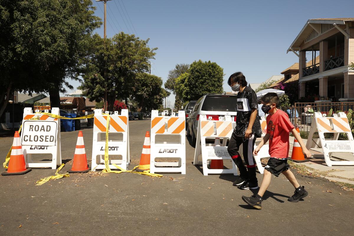 East 27th Street between Stanford Avenue and San Pedro Street remains closed to cars