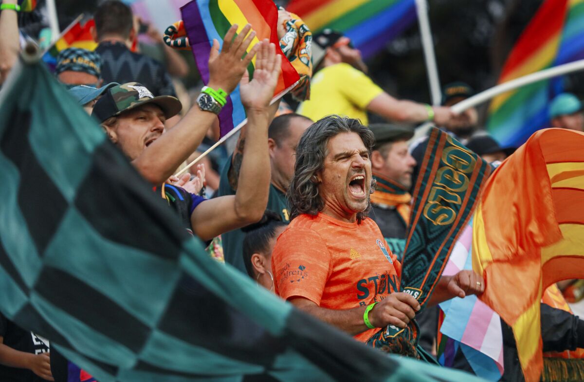 Fans in the stands show their support for the San Diego Loyal soccer team.
