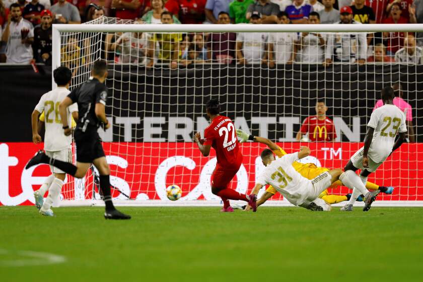 Bayern Munich defender Jerome Boateng (C) scores a goal against Real Madrid during their International Champions Cup match on July 20, 2019 at NRG Stadium in Houston, Texas. (Photo by AARON M. SPRECHER / AFP)AARON M. SPRECHER/AFP/Getty Images ** OUTS - ELSENT, FPG, CM - OUTS * NM, PH, VA if sourced by CT, LA or MoD **