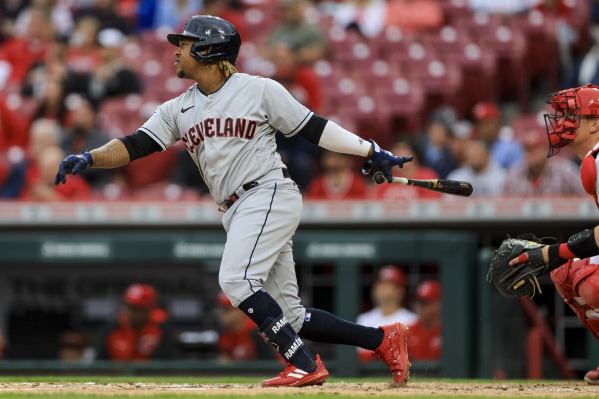 Cleveland Guardians' Jose Ramirez watches his two-run home run during the fourth inning of a baseball game against the Cincinnati Reds in Cincinnati, Wednesday, April 13, 2022. (AP Photo/Aaron Doster)