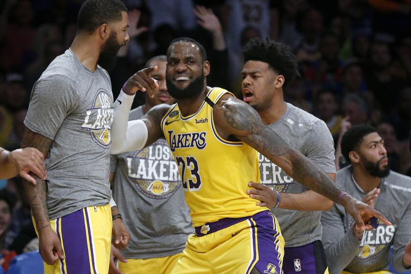 LOS ANGELES, CALIF. -- FRIDAY, MARCH 6, 2020: Los Angeles Lakers forward LeBron James (23) celebrates after making a basket and fouled for a three point attempt against the Milwaukee Bucks in the second half of the Lakers 113-103 win at the Staples Center in Los Angeles, Calif., on March 6, 2020. (Gary Coronado / Los Angeles Times)