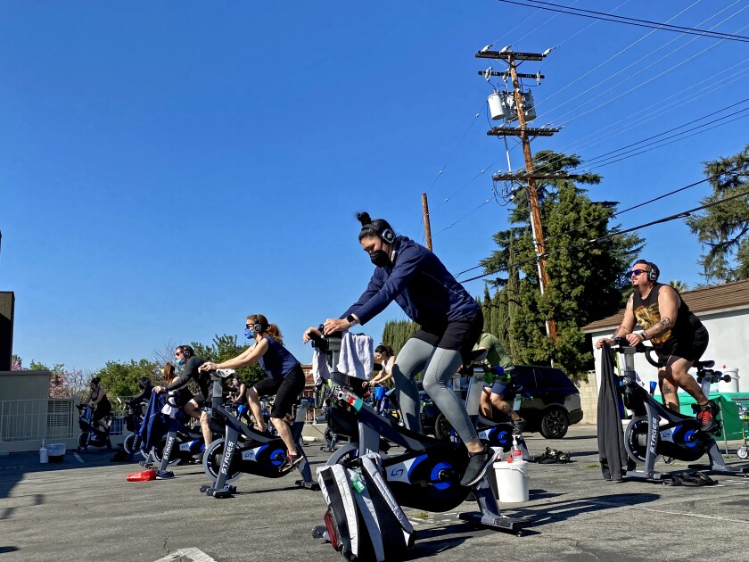 Cyclists on stationary bikes