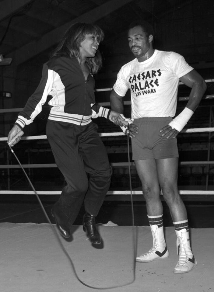 Former heavyweight boxing champion Ken Norton Sr. watches singer Tina Turner jump rope in the ring at Caesars Palace in Las Vegas in 1977.