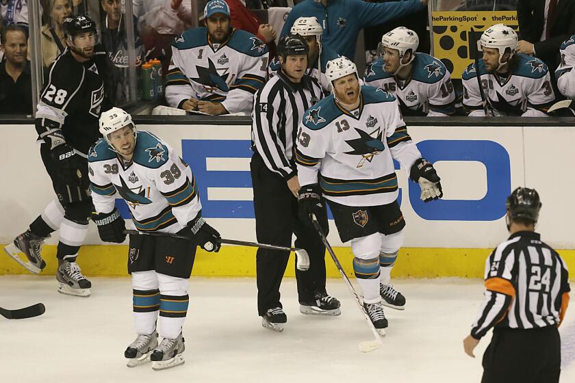Sharks forward Raffi Torres yells at referee Stephen Walcom after he is called for a penalty after hitting Kings center Jarret Stoll during the second period of a playoff game in 2013.