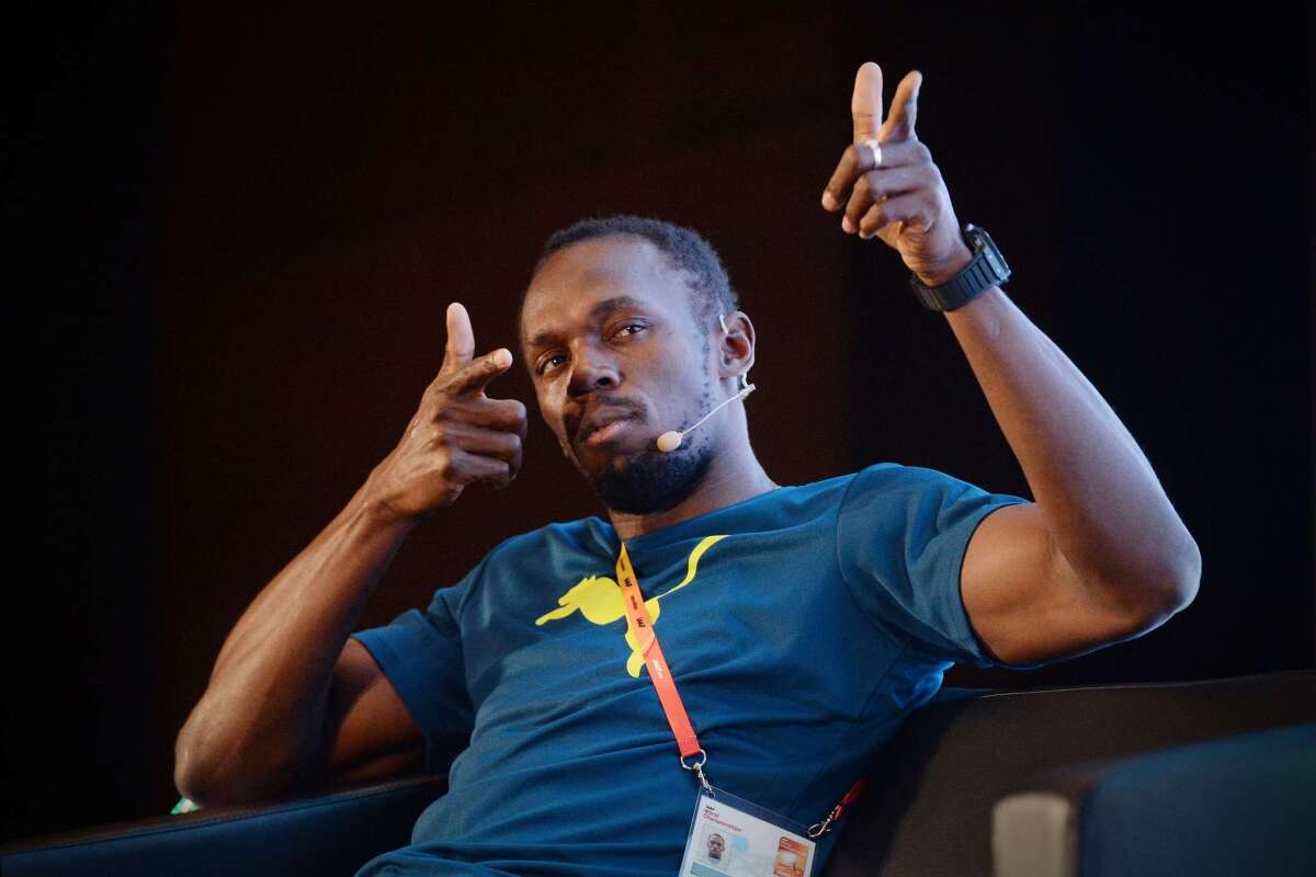 Jamaica athlete Usain Bolt speaks during a press conference Thursday in Beijing.